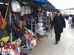 Before you get to the Leaning Tower, you must pass the teeming souvenir stands.